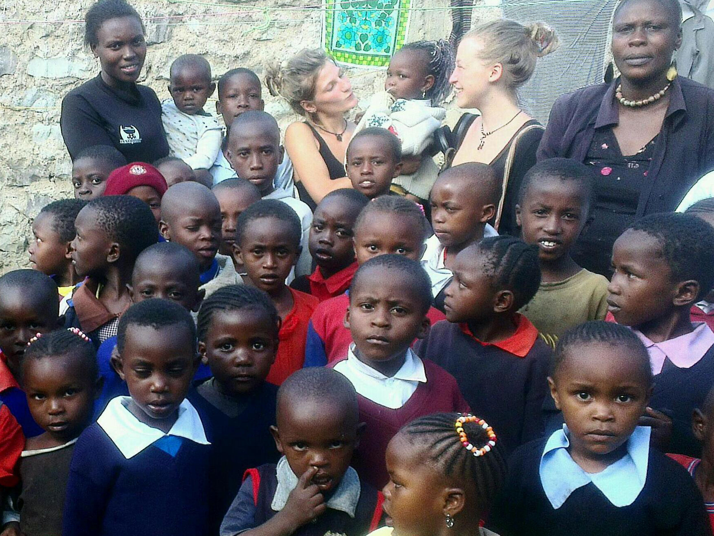 The first group picture with the students, headteacher Joyce (right) and the nursery teacher (left), 2013.